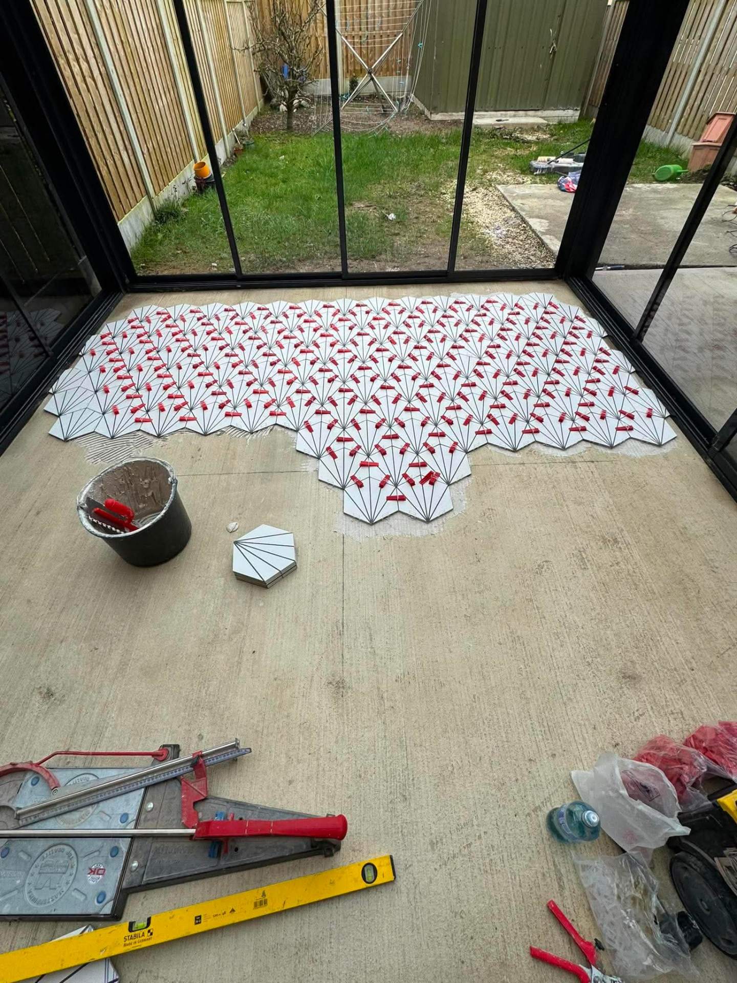 Cement-look patterned floor laid in a sunroom