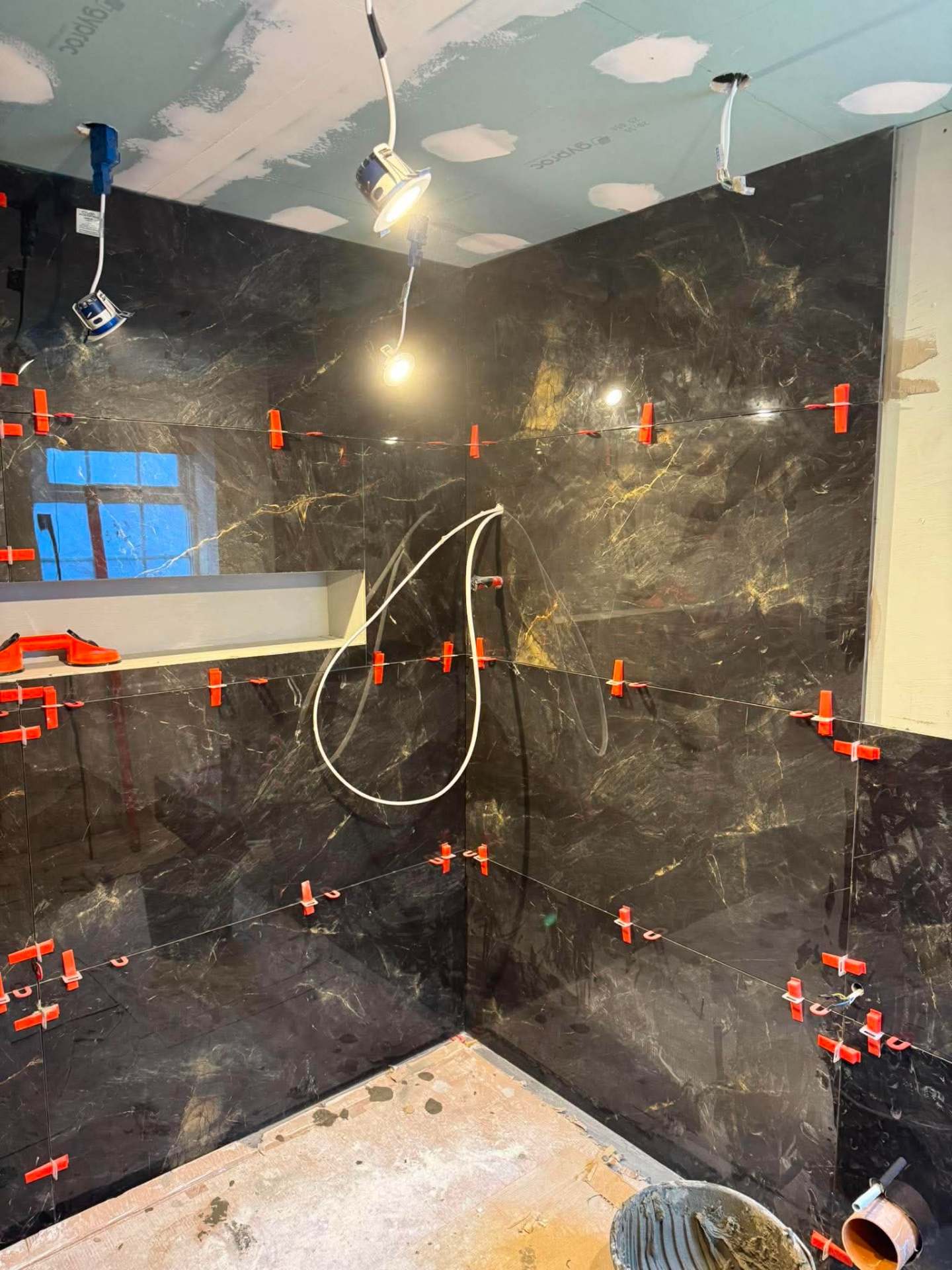 Dark marble wall — vein-matched detail close-up
