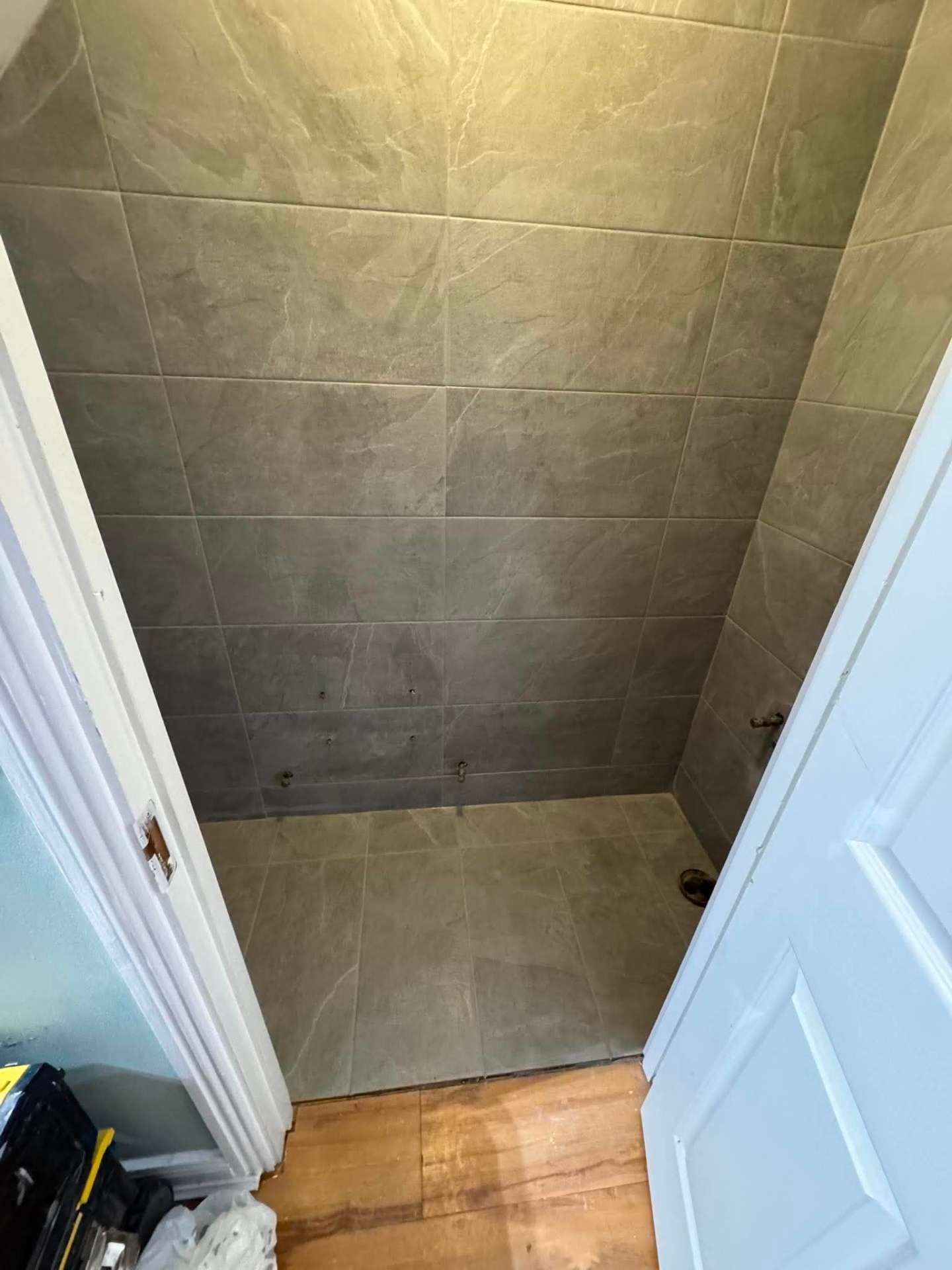 Finished stone-effect shower from the doorway