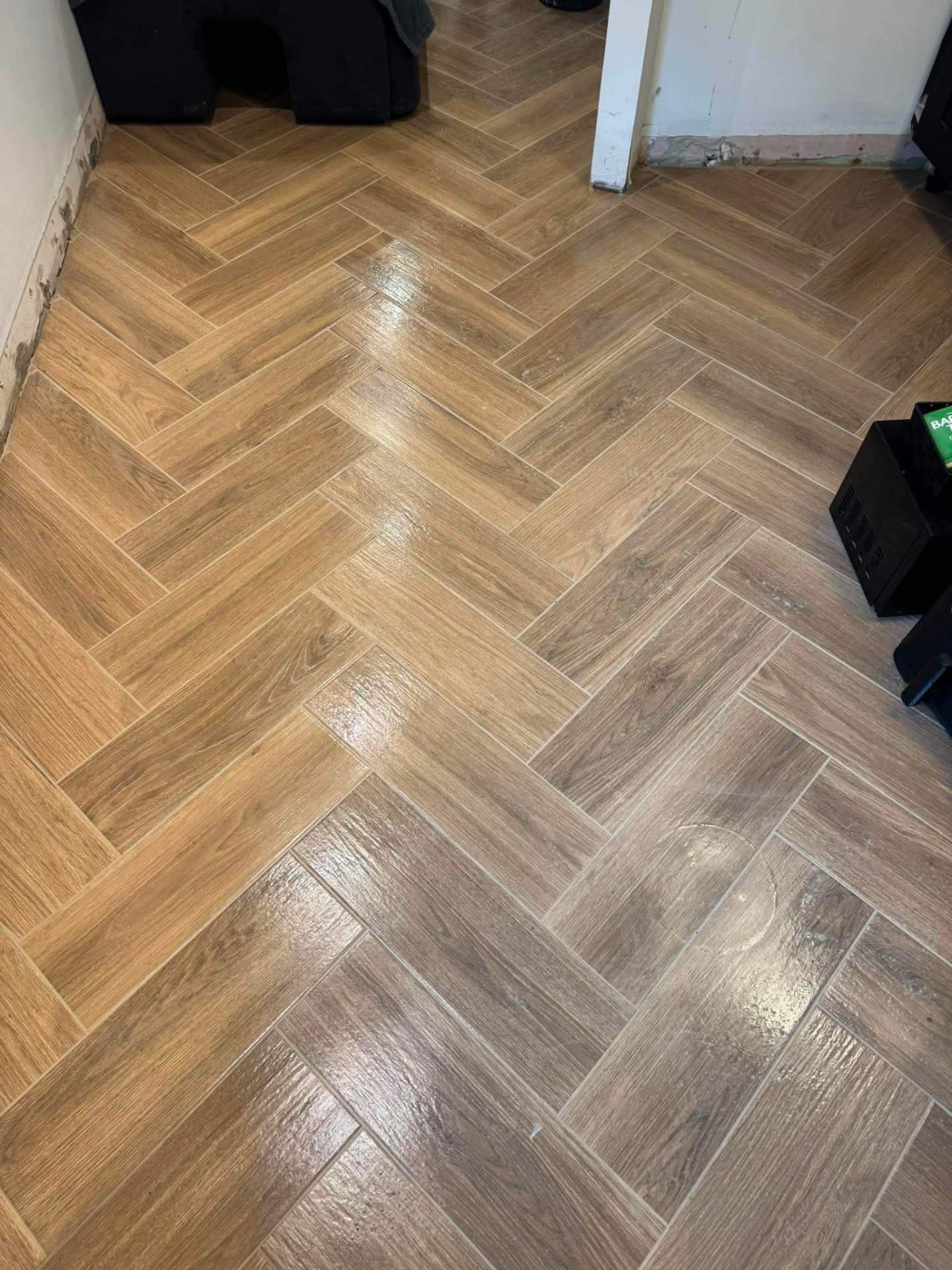 Wood-effect herringbone floor through to next room, finished