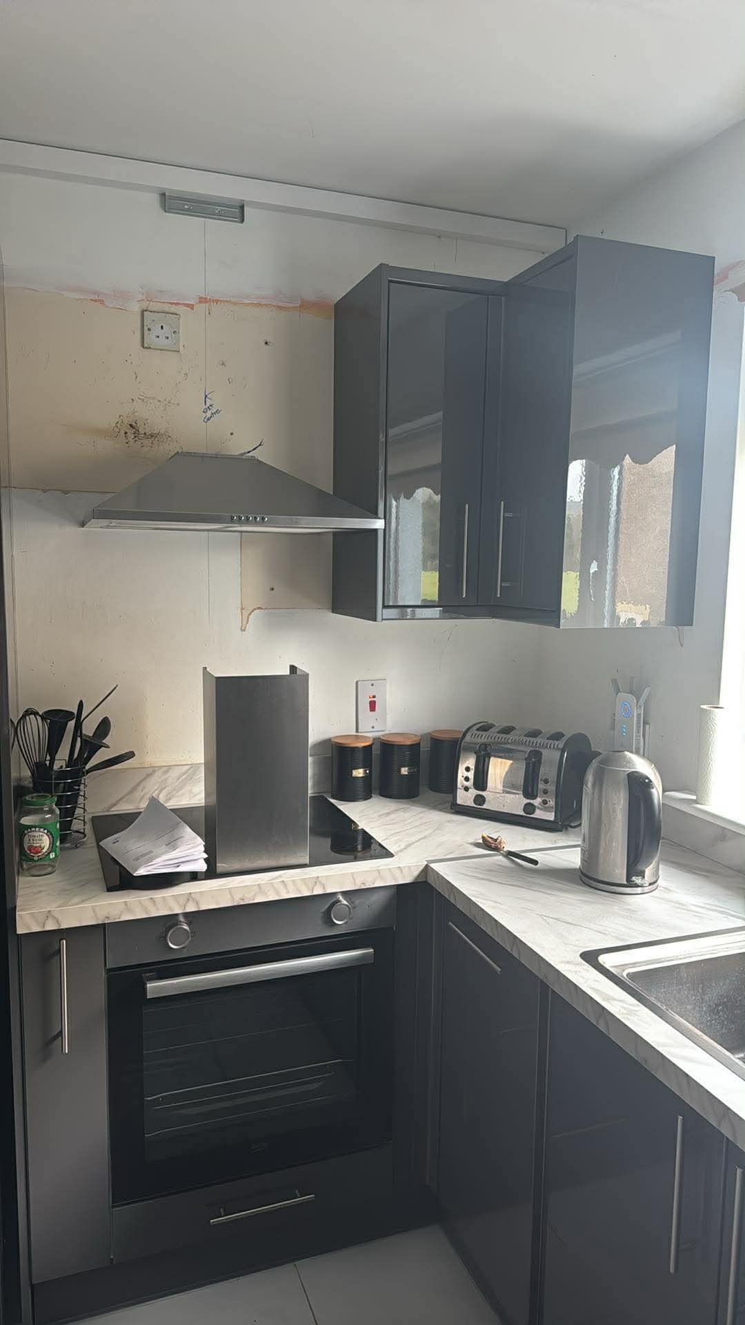 Navy shaker — before, dated splashback around hob