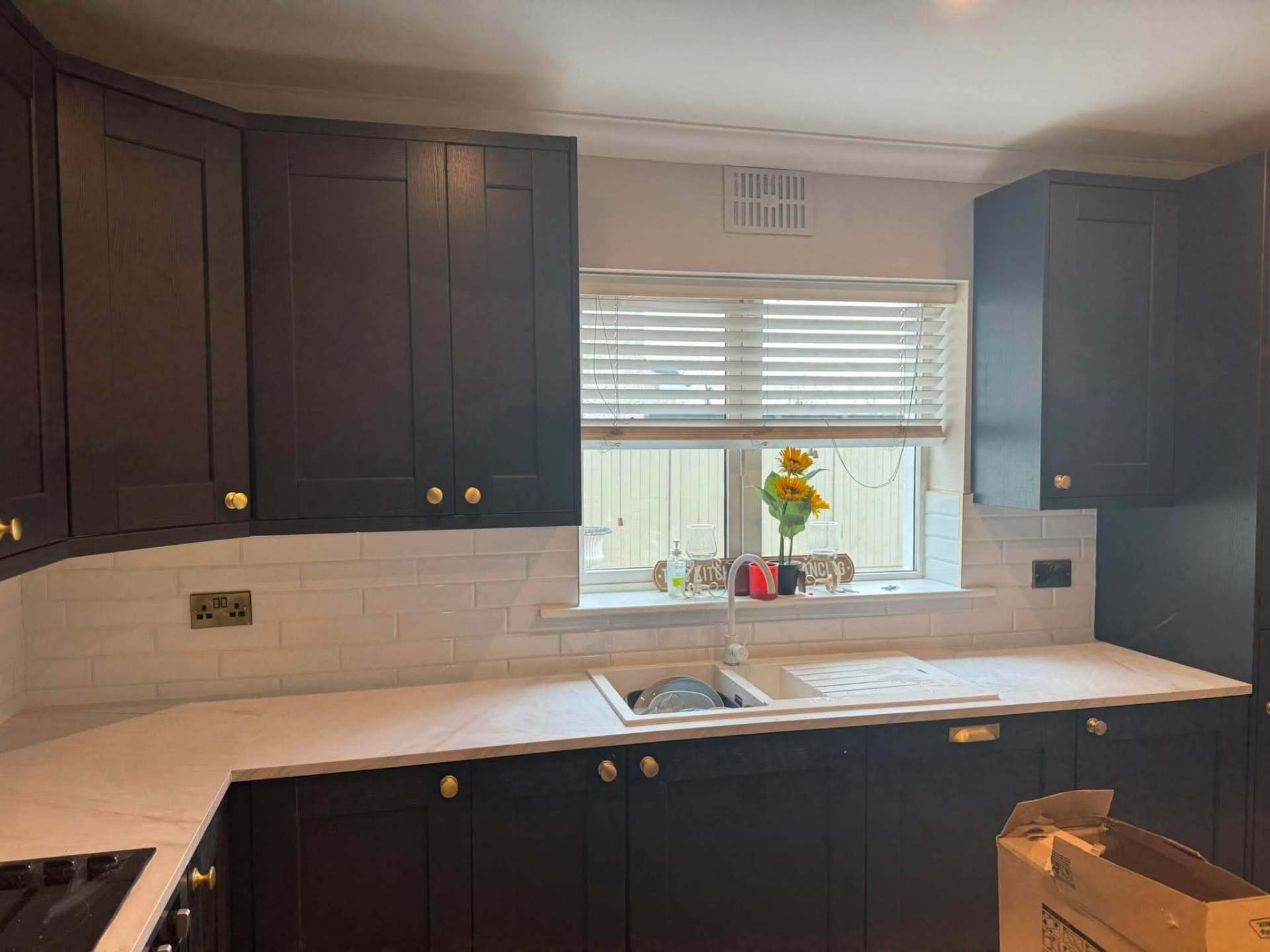 Grey shaker — first courses of Calacatta splashback set out