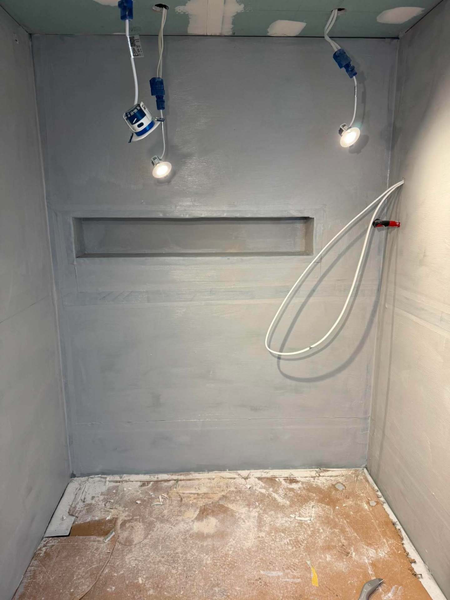 Calacatta marble walk-in shower — finished with recessed niche