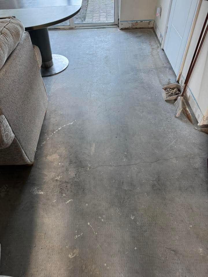 Open-plan kitchen — bare concrete sub-floor before tiling