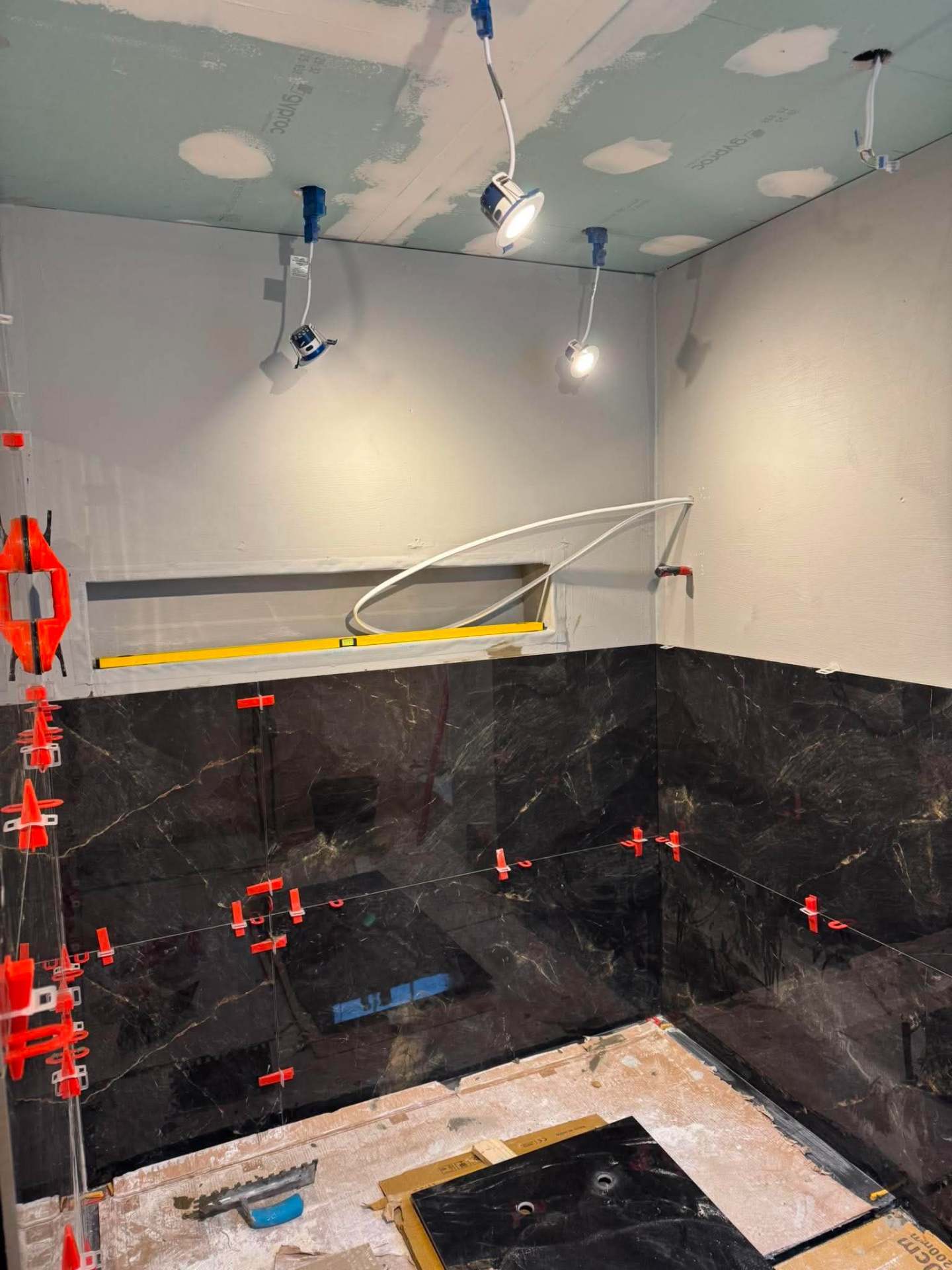 Dark marble — niche detail with clips during install