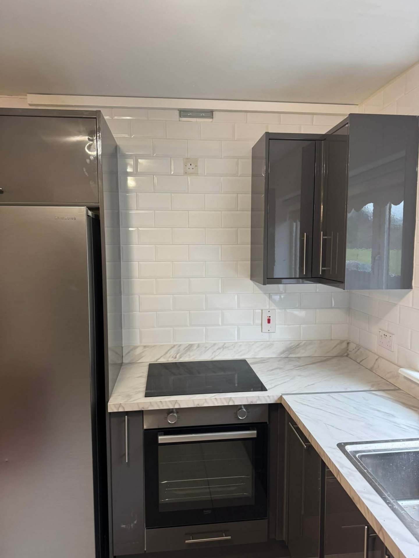 Navy shaker — bevelled metro going up around hood
